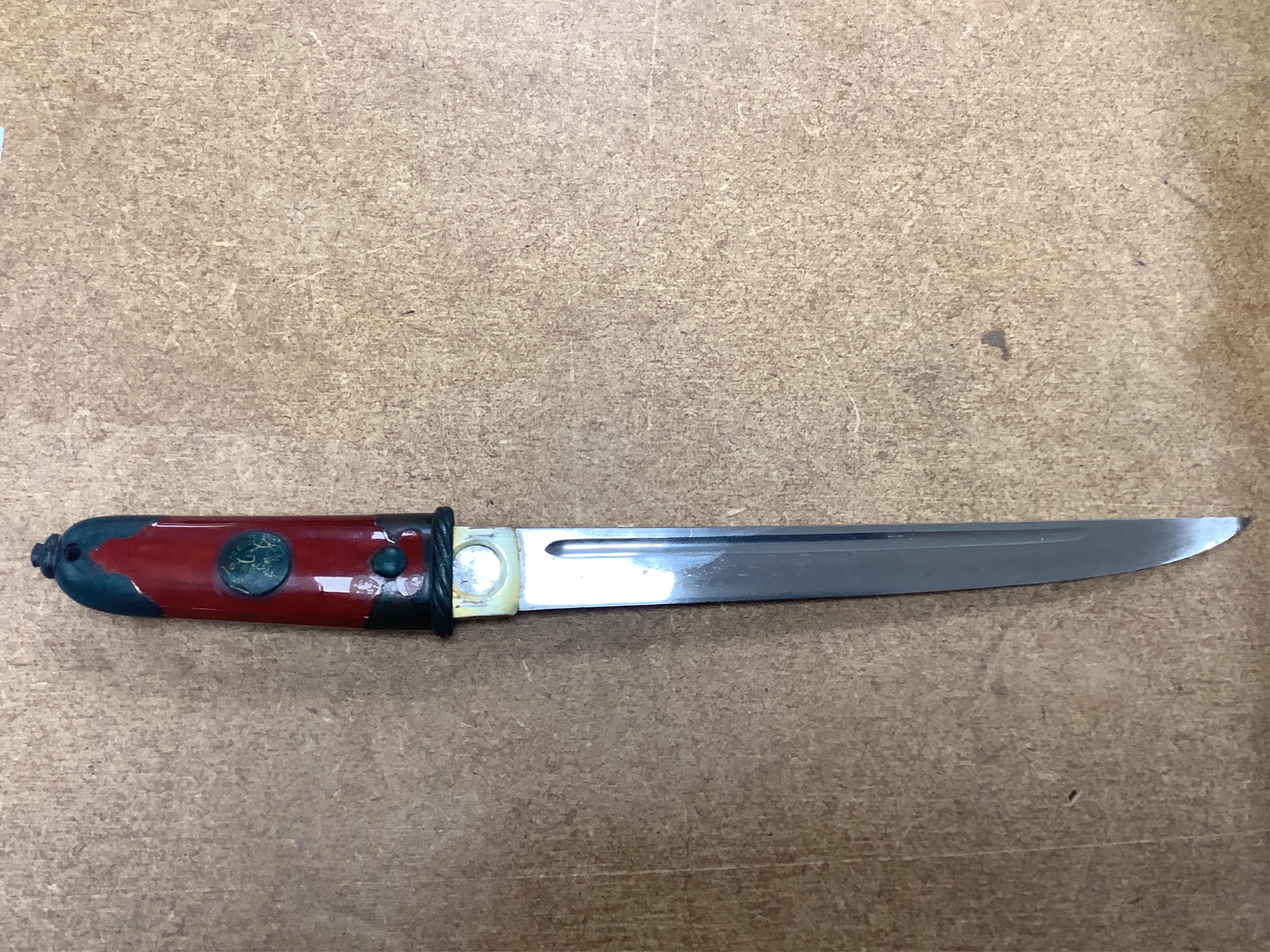 A Japanese knife in lacquered sheath and a handle, largest 34cm in length. Condition - fair to good